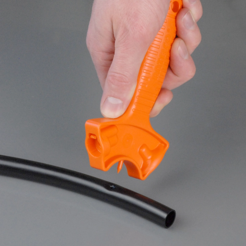 DripMate® Tool punching hole into tube